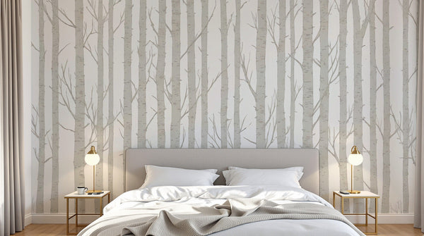 Chambre avec papier peint bouleau sur mesure : troncs blancs fins et serrés derrière la tête de lit